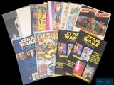 a lot of star wars comic books on the table