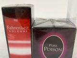 a close up of two boxes of perfume on a table