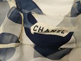 a close up of a blue and white dress with a label on it