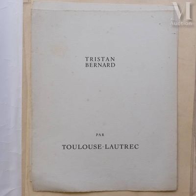 an old book sitting on top of a table next to a white table cloth