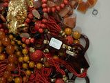 a pile of assorted beads and other items on a table