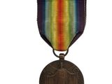 an image of a medal with a rainbow ribbon on it