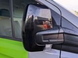 a reflection of a fire truck in the side mirror of a car