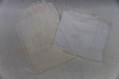 two pieces of white clothing on a white surface