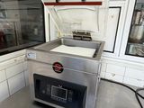 a silver counter top with a silver oven on it