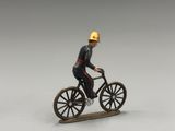 a close up of a figurine of a man riding a bike