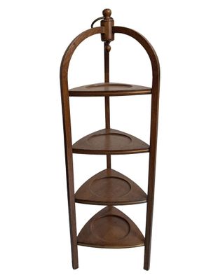 a wooden shelf with three shelves on top of it