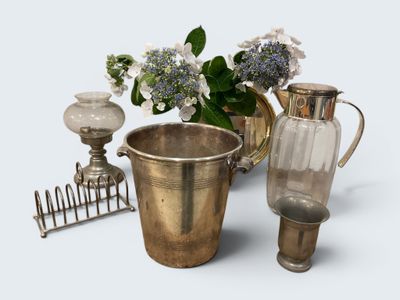 a vase and a pitcher sitting next to each other on a table