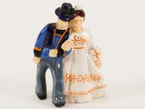 a figurine of a man and a woman standing next to each other
