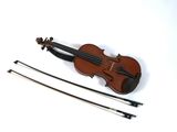 a violin that is sitting on a white surface