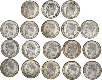 a group of twenty different british coins on a white background