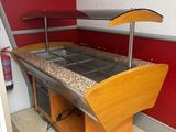 an image of a kitchen with granite counter tops and red walls