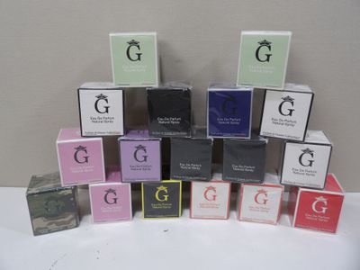 many different boxes of perfume sitting on a table