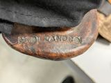 a close up of a person ' s feet wearing black shoes and a black hat