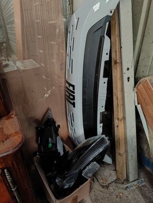a white van that is sitting in a pile of junk