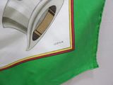 a picture of a toaster on a green and white cloth