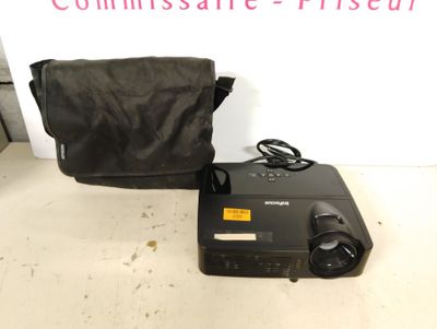 an image of a portable projector with a bag on the table