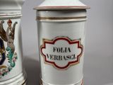 two ceramic containers that are sitting next to each other