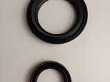 two black rings on a white surface next to each other