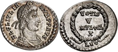 a silver coin with an image of a woman on it