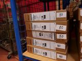 many boxes that are stacked on a shelf in a store