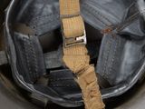 a close up of a helmet with a strap on it