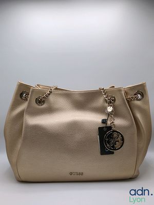 a close up of a purse with a tag on it