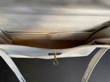the inside of a white purse with a zipper on it