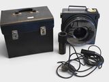 a black box with a fan and a black box with a power cord