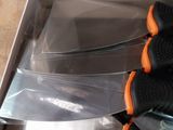 four knives in a box on the floor