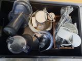a drawer full of kitchen utensils and other items