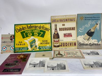 several different types of advertising posters are displayed on a table