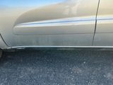 a close up of a car ' s side door with a flat tire