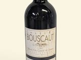 a bottle of wine that is sitting on a table