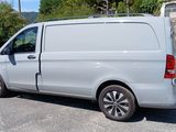 a white van that is parked in a parking lot