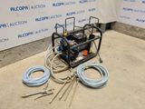 a machine that is sitting on the ground next to some hoses