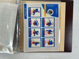 a binder with a picture of a bird on it next to a sheet of paper