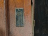 a close up of a wooden door with a sign on it