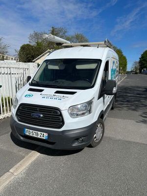 a white van that is parked on the side of the road