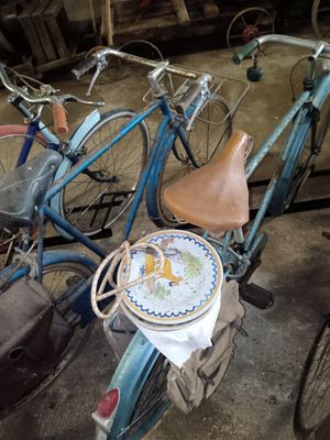 a blue bicycle with a basket on the back of it