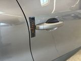 a close up of a car door handle with a sticker on it