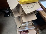 a pile of boxes sitting on top of a wooden table