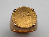 an image of a gold coin ring with a woman ' s face on it