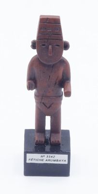 figurine of a man standing on a black base with a white background
