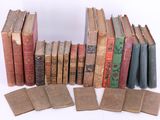 many old books stacked on top of each other