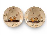 two plates that have birds on them on them
