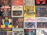 many different types of vinyl records on the wall