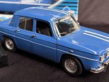 a blue toy car sitting next to a black box