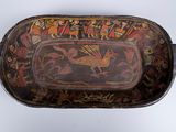 a decorative tray with a picture of a bird on it