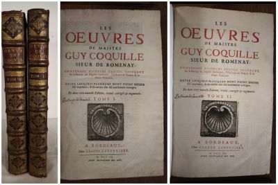 two old books sitting on top of a table next to each other